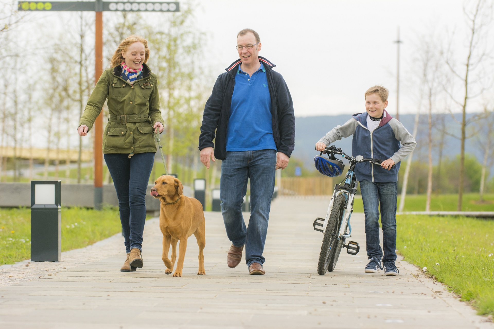 Dog walkers and bike at Inverness Campus